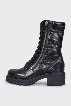 Black leather boots with tag