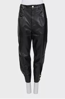 Leather trousers with buttons at the bottom of the legs