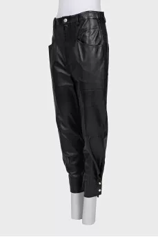 Leather trousers with buttons at the bottom of the legs