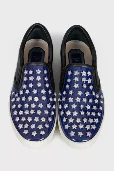Blue leather slip-ons with decor