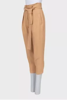 Beige tapered trousers with a belt