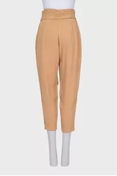 Beige tapered trousers with a belt