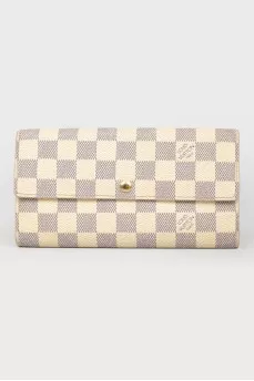 White wallet in a corporate print