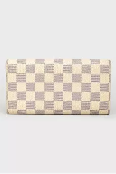 White wallet in a corporate print