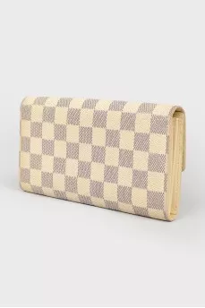 White wallet in a corporate print