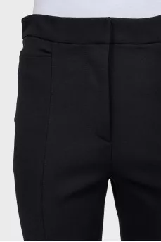 Straight black trousers with slits at the bottom