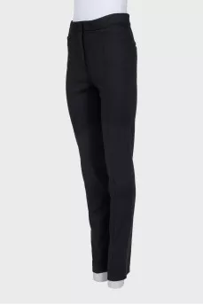 Straight black trousers with slits at the bottom