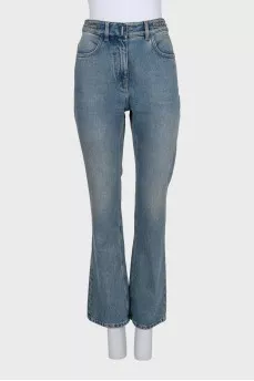 Blue jeans with a silver chain tag