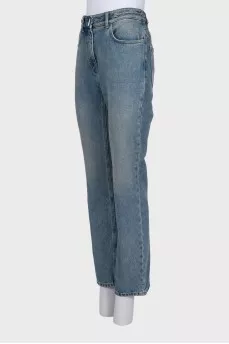 Blue jeans with a silver chain tag