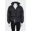 Black down jacket with zip pockets and tag