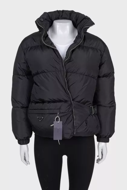 Black down jacket with zip pockets and tag