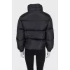 Black down jacket with zip pockets and tag