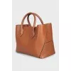 Brown bag with gold logo
