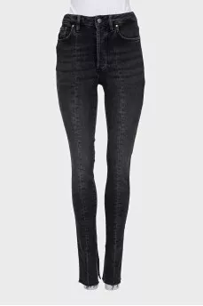 Black jeans decorated with slits