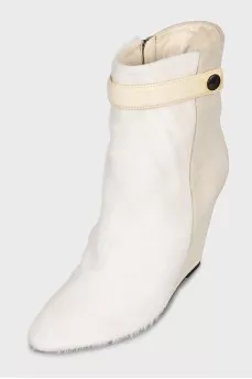 Suede ankle boots with a zipper and a wedge heel