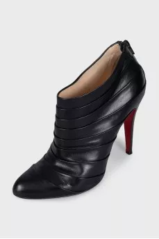 Black ankle boots with pleated leather