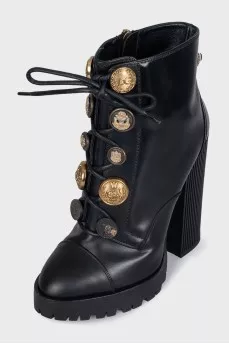 Black ankle boots with massive decor
