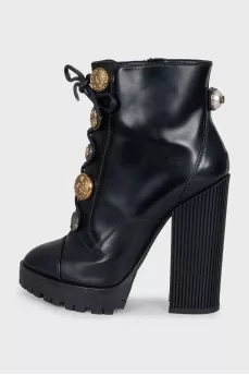 Black ankle boots with massive decor