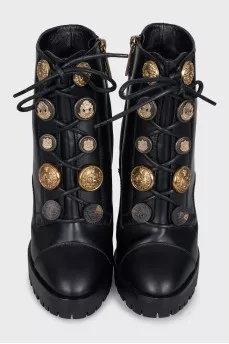 Black ankle boots with massive decor