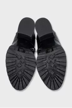 Black ankle boots with massive decor