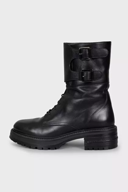 Leather boots with laces and buckles