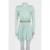Fitted dress with a gold belt