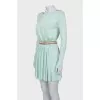Fitted dress with a gold belt