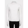 Knitted white sweater with a pattern