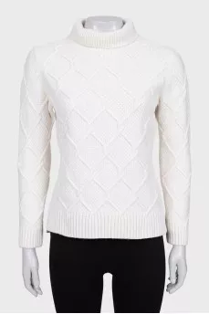 Knitted white sweater with a pattern