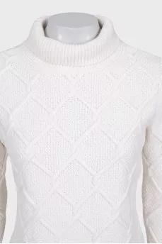 Knitted white sweater with a pattern