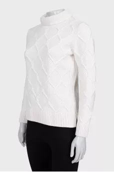 Knitted white sweater with a pattern