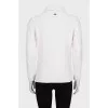 Knitted white sweater with a pattern
