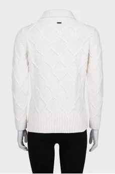 Knitted white sweater with a pattern