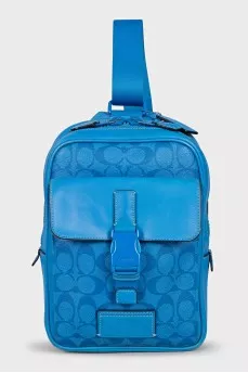 Canvas and leather backpack with a patch pocket