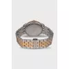 Men's silver watch with gold accents