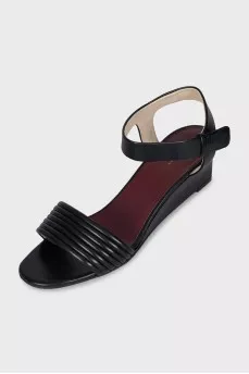 Leather sandals with a medium wedge heel