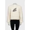 Beige sweater with a patch