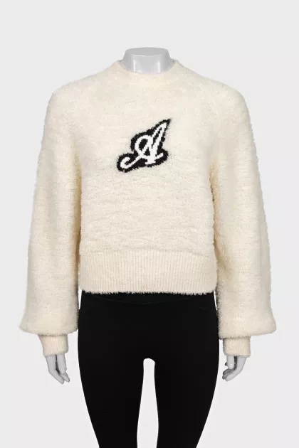 Beige sweater with a patch