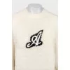 Beige sweater with a patch