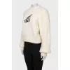 Beige sweater with a patch