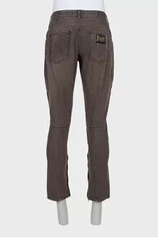 Men's jeans with zippers at the bottom with tag
