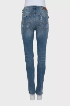 Рваные джинсы skinny fit с шипами