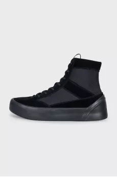 Black sneakers with suede inserts and a removable sole