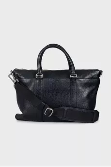 Leather bag with a textile strap