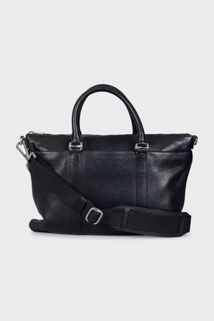 Leather bag with a textile strap