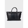 Leather bag with a textile strap