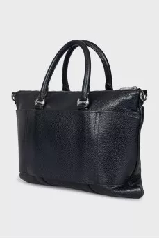 Leather bag with a textile strap