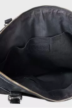 Leather bag with a textile strap