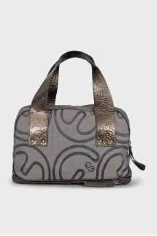 Textile bag with patent leather handles