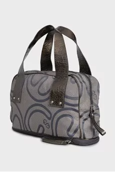 Textile bag with patent leather handles